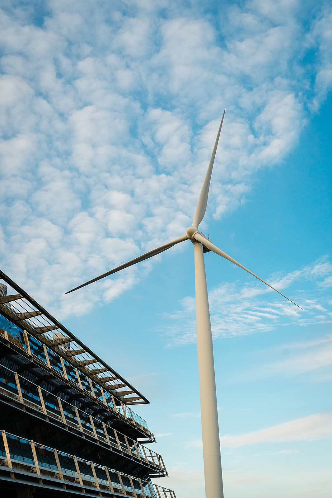 Wind turbine against blue sky