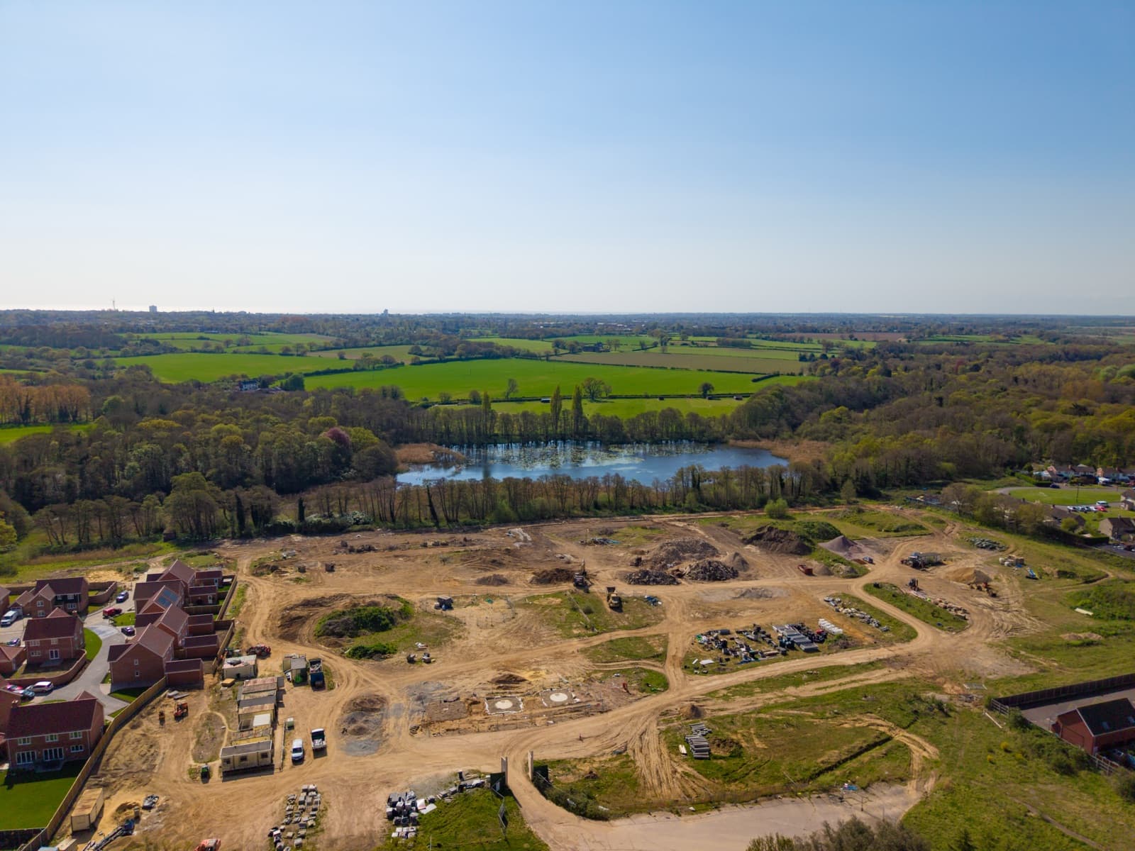 Aerial view of a residential development site under construction — residential development solicitors in Norfolk and Suffolk