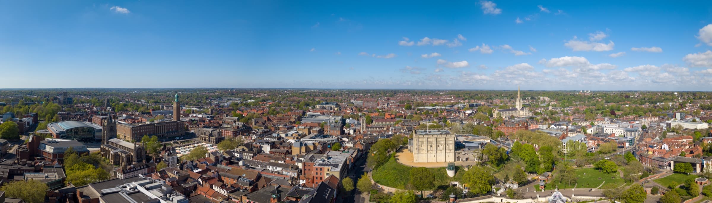 Norwich rooftops from the air, the castle and cathedral among them — spousal maintenance solicitors in Lowestoft and Norwich