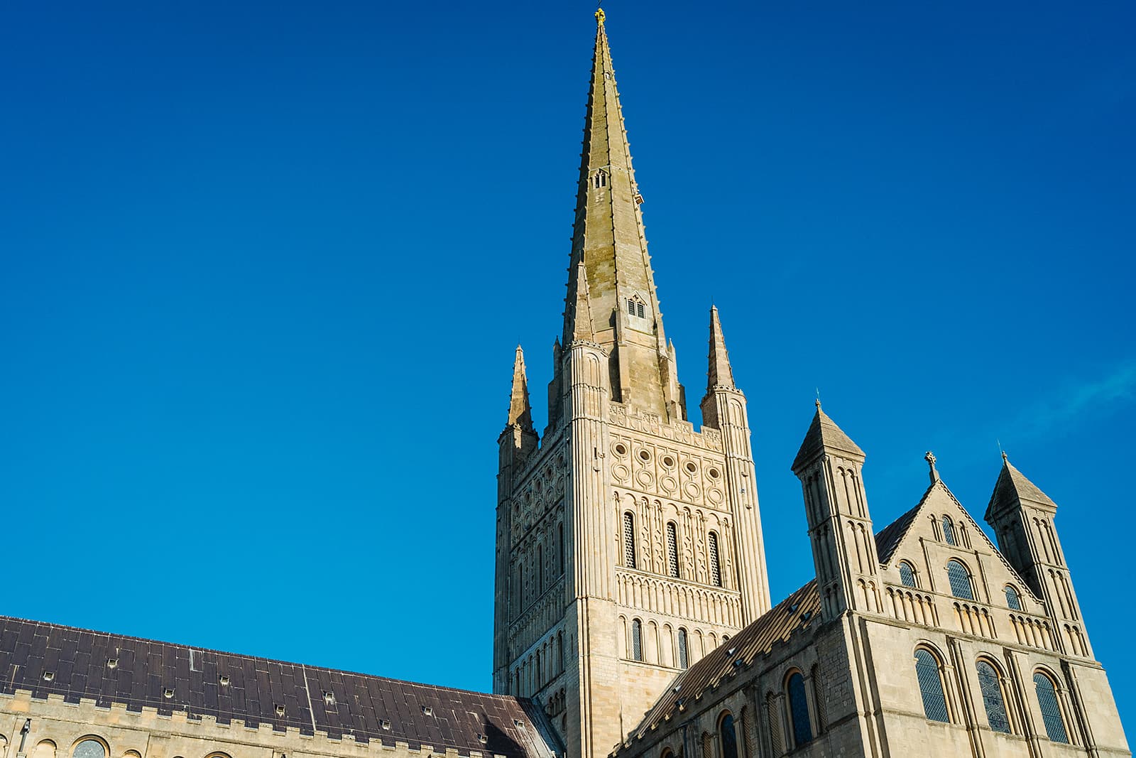 Norwich Cathedral tower and spire against a clear blue sky — prenuptial and postnuptial agreement solicitors in Lowestoft and Norwich