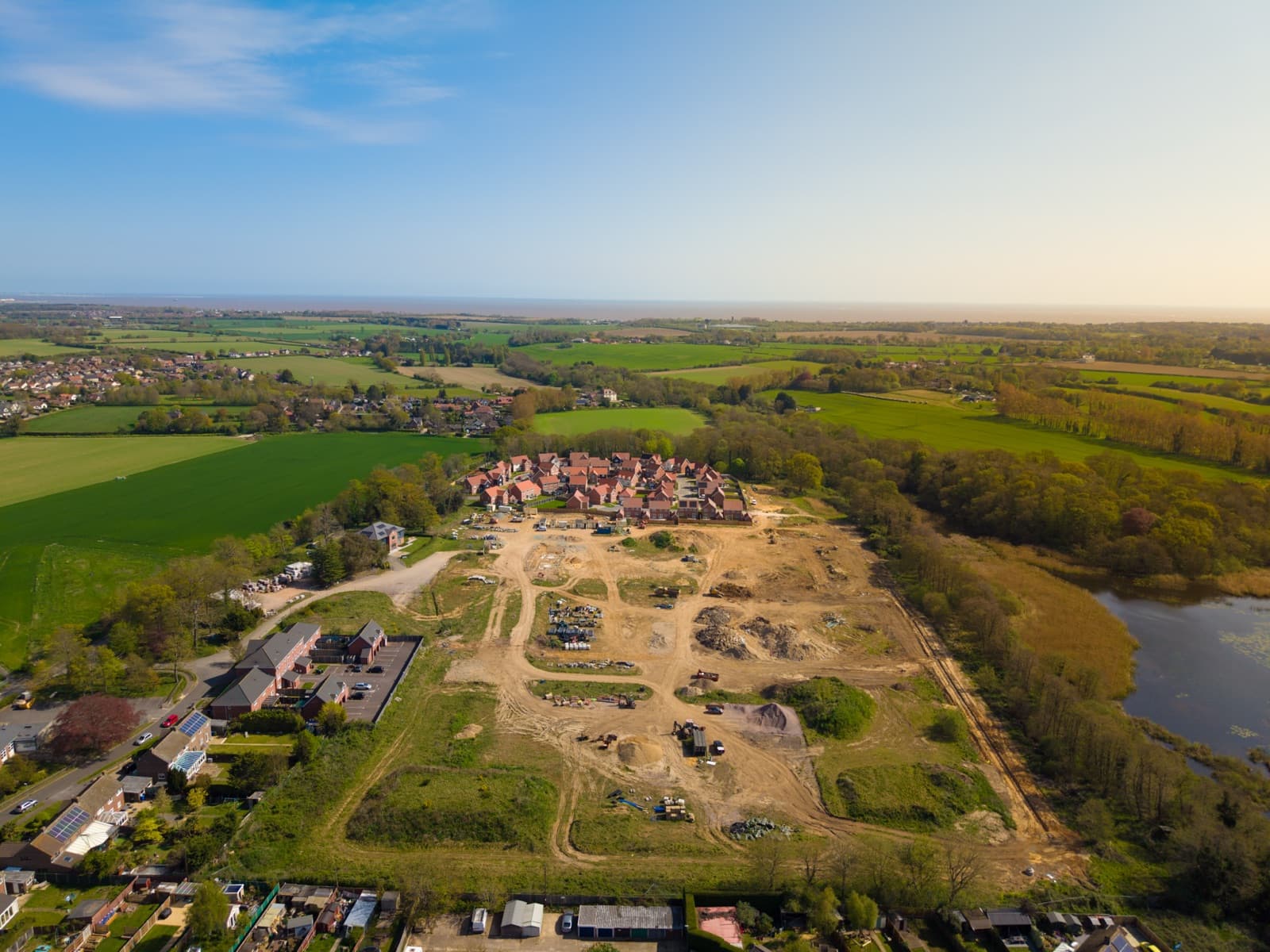 Aerial view of land being brought forward for development alongside open countryside — strategic land and development solicitors in Norfolk and Suffolk