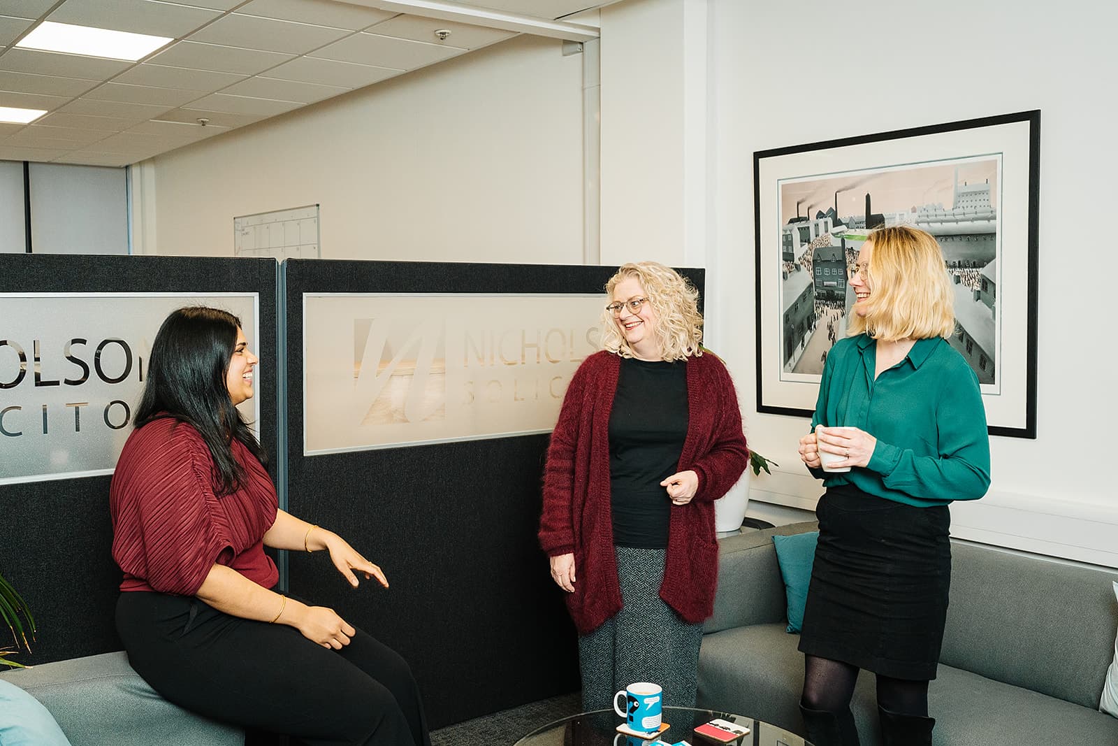 Nicholsons team chatting in the office